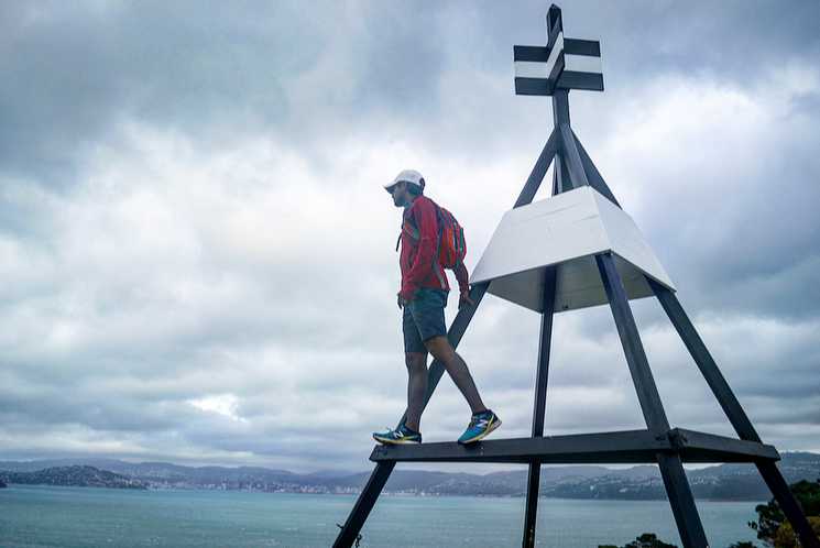 A student looking at a view of the ocean.